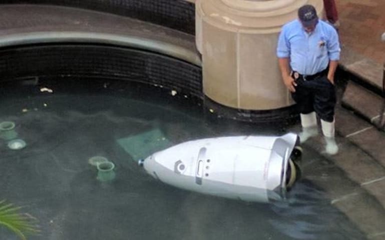 DC security robot can't take the job pressure, jumps in pool to end itself