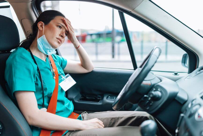 young-nurse-in-car-stressed.jpg