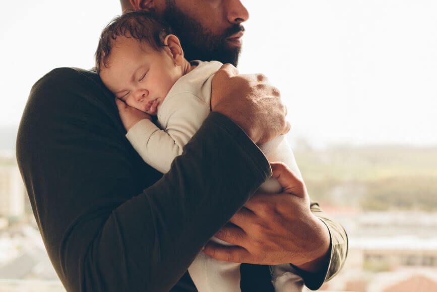 newborn-in-fathers-arms.jpg