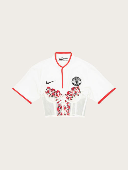 Photo de la pièce Ensemble top et jupes Manchester United disponible à la location en ligne ou dans notre showroom à Paris