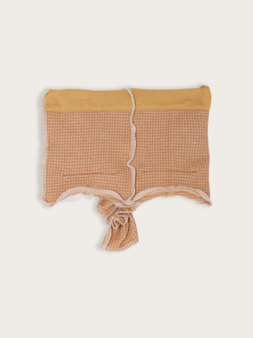 Photo de la pièce Top bustier beige disponible à la location en ligne ou dans notre showroom à Paris