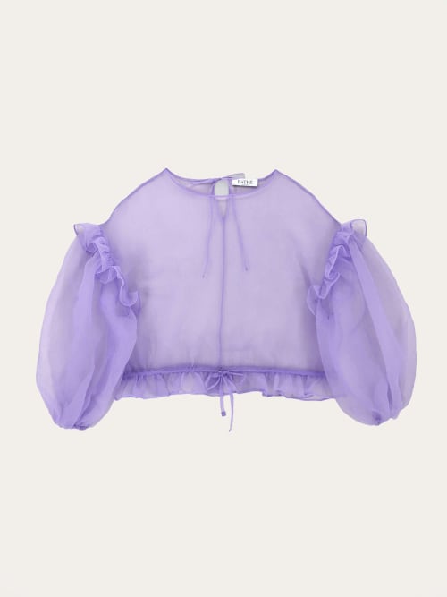 Photo de la pièce Top lilas transparent manches longues bouffantes  disponible à la location en ligne ou dans notre showroom à Paris