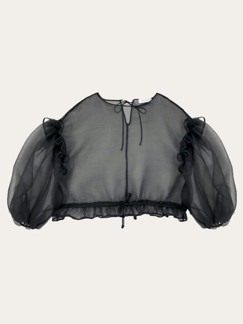 Photo de la pièce Top noir transparent manches longues bouffantes disponible à la location en ligne ou dans notre showroom à Paris