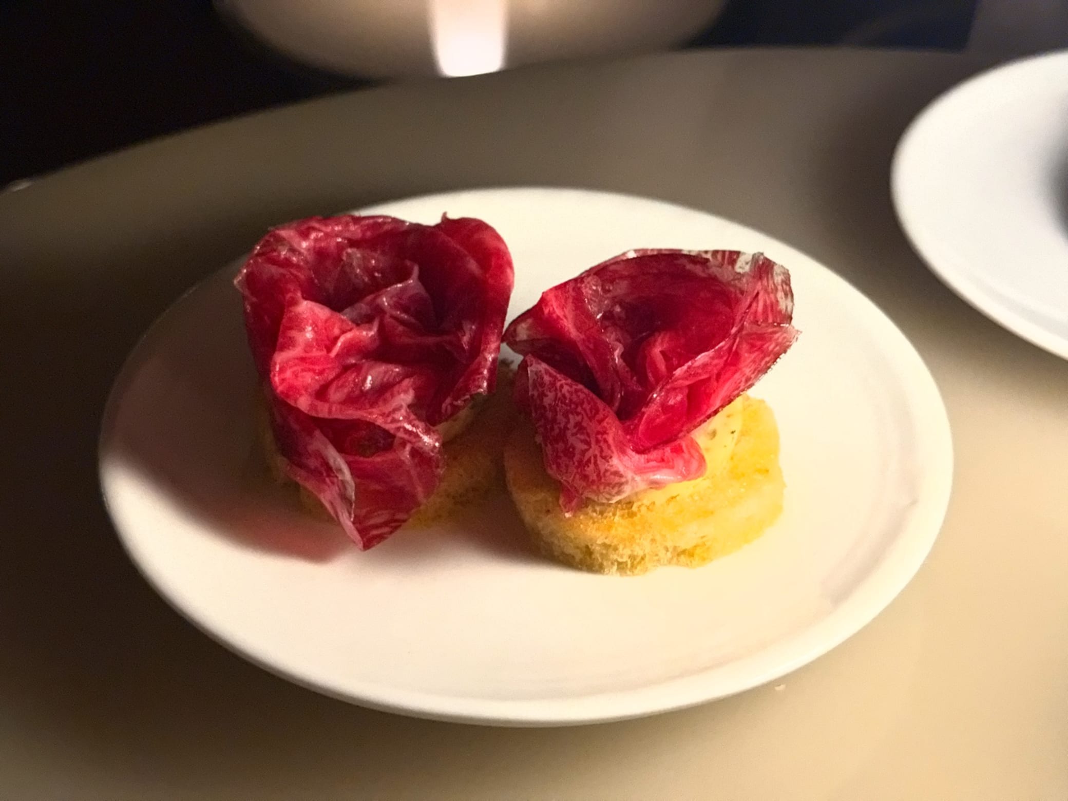 Wagyu Bresaola, Montpellier Butter, Pickled Shallot, Sourdough Crostini at Bennelong