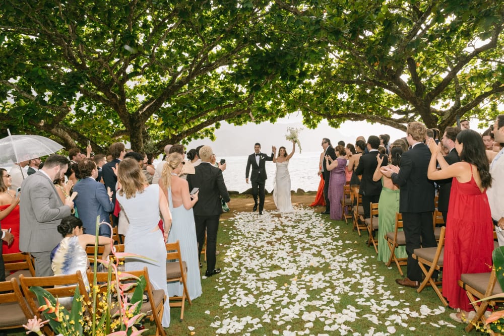 Wedding ceremony recessional under the trees at 1 Hotel Hanalei Bay Kauai