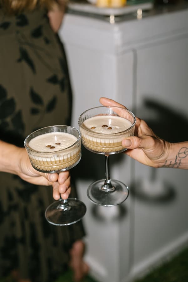 Espresso martini cheers during a Kualoa Ranch wedding reception on Oahu