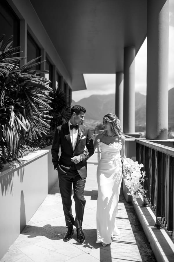 Bride and groom on the lanai with mountain views at 1 Hotel Hanalei Bay Kauai
