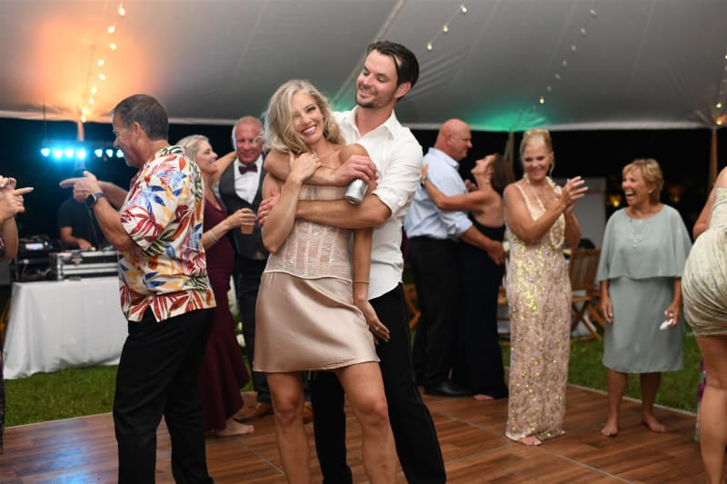Guests filling the dance floor at a Loulu Palms Farm Estate wedding reception