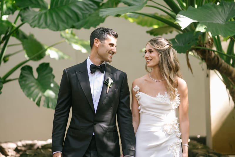 Wedding couple among tropical foliage at 1 Hotel Hanalei Bay Kauai
