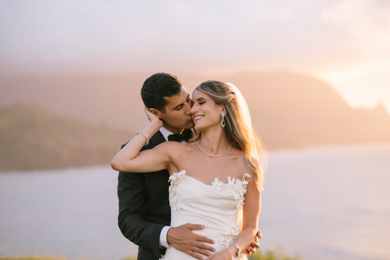 Bride and groom at sunset over Hanalei Bay at 1 Hotel Hanalei Bay Kauai