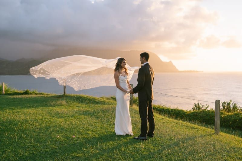 Bride's veil catching the breeze at sunset at 1 Hotel Hanalei Bay on Kauai