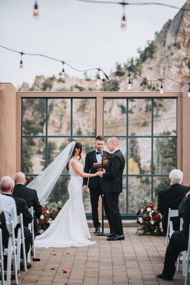 Wedding ceremony under string lights at Snow Basin Resort in Huntsville, Utah