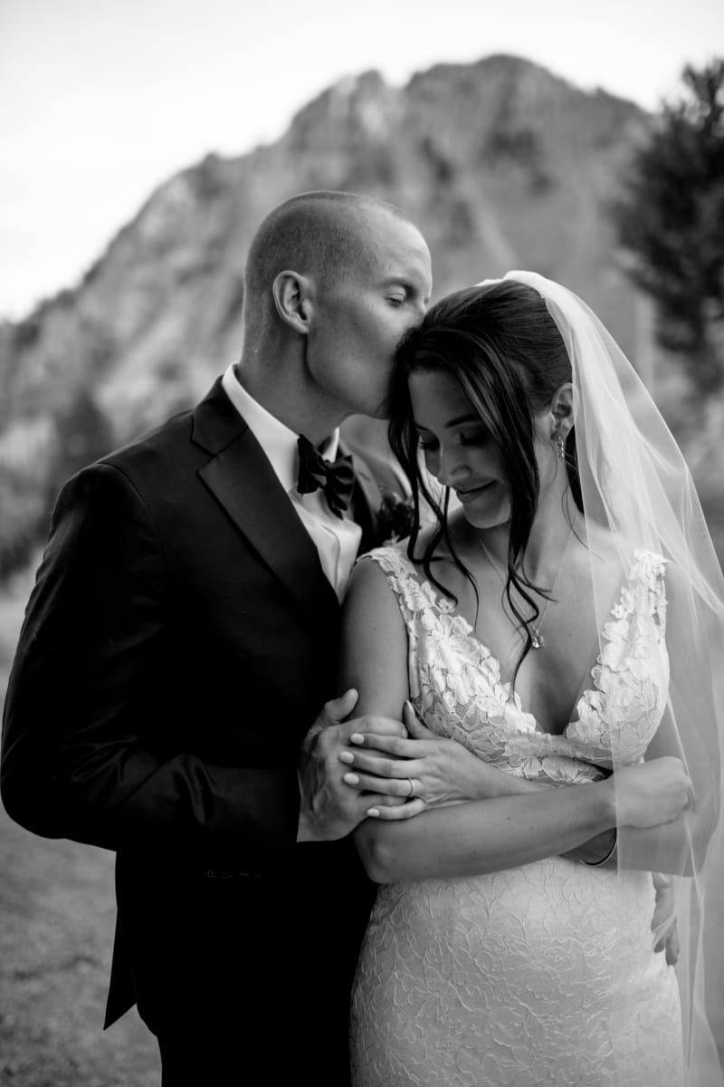 Black and white portrait of a couple embracing at Snow Basin in Huntsville, Utah
