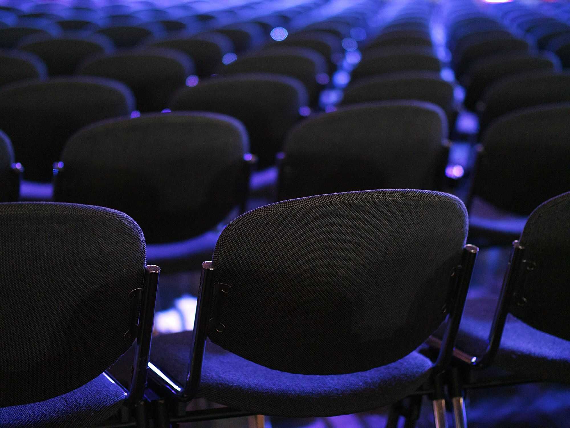 Empty auditorium chairs