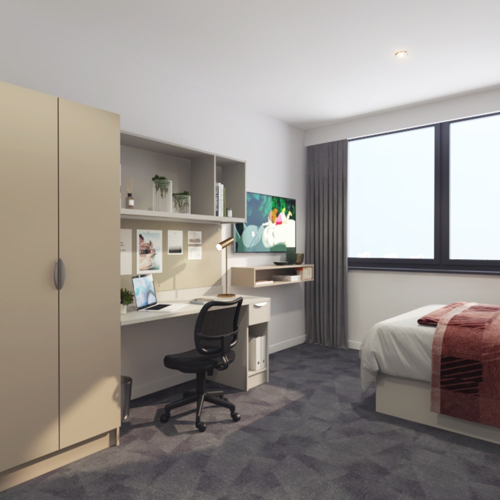 Student studio room with bed, TV, wardrobe and desk