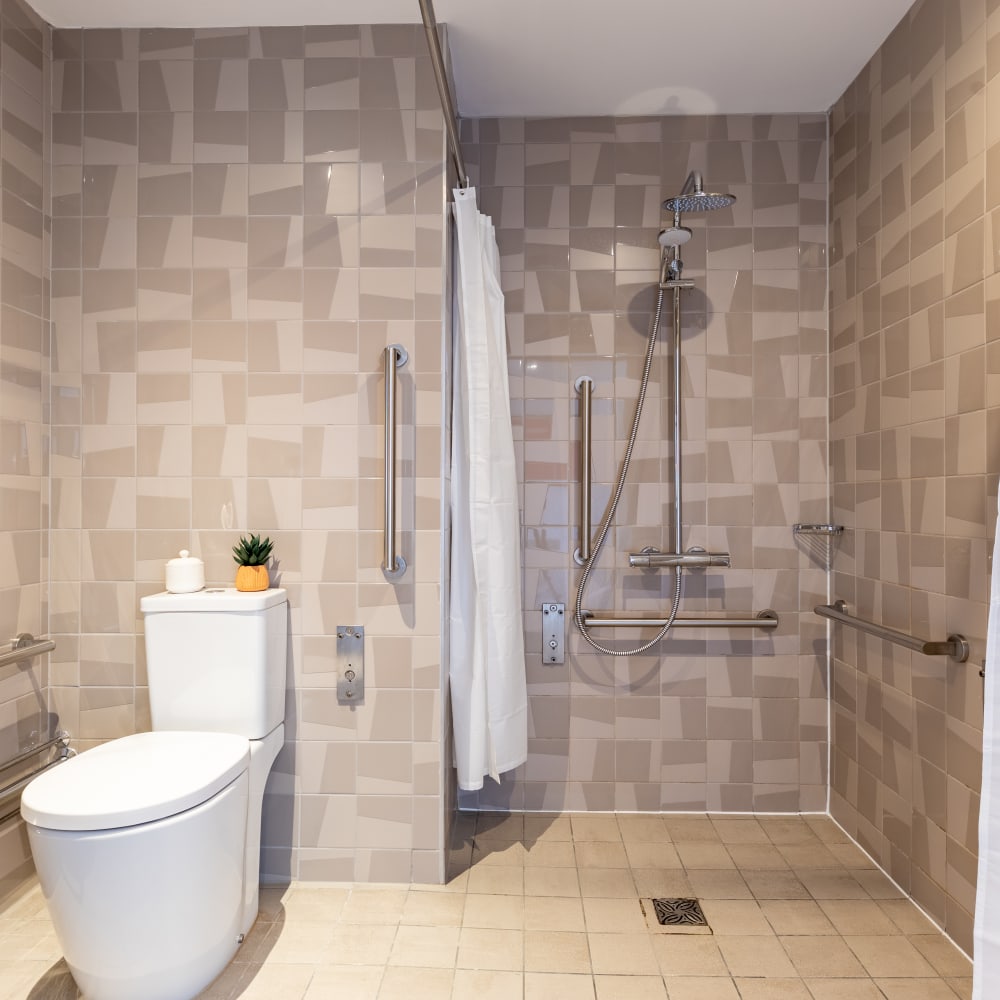 Accessible Studio en suite with a toilet and shower