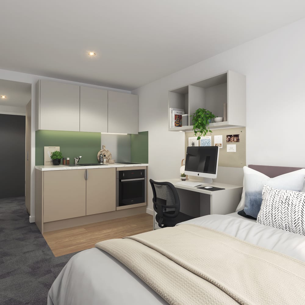 Student room with bed, desk area, kitchenette and storage