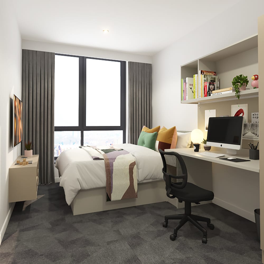 Cosy student room with coloured bedding and desk area
