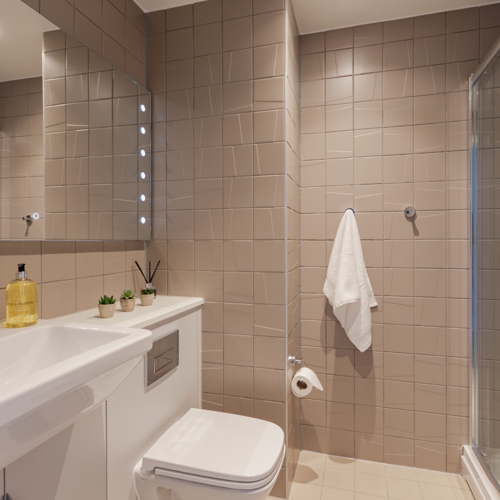 Student ensuite with a shower, toilet and sink