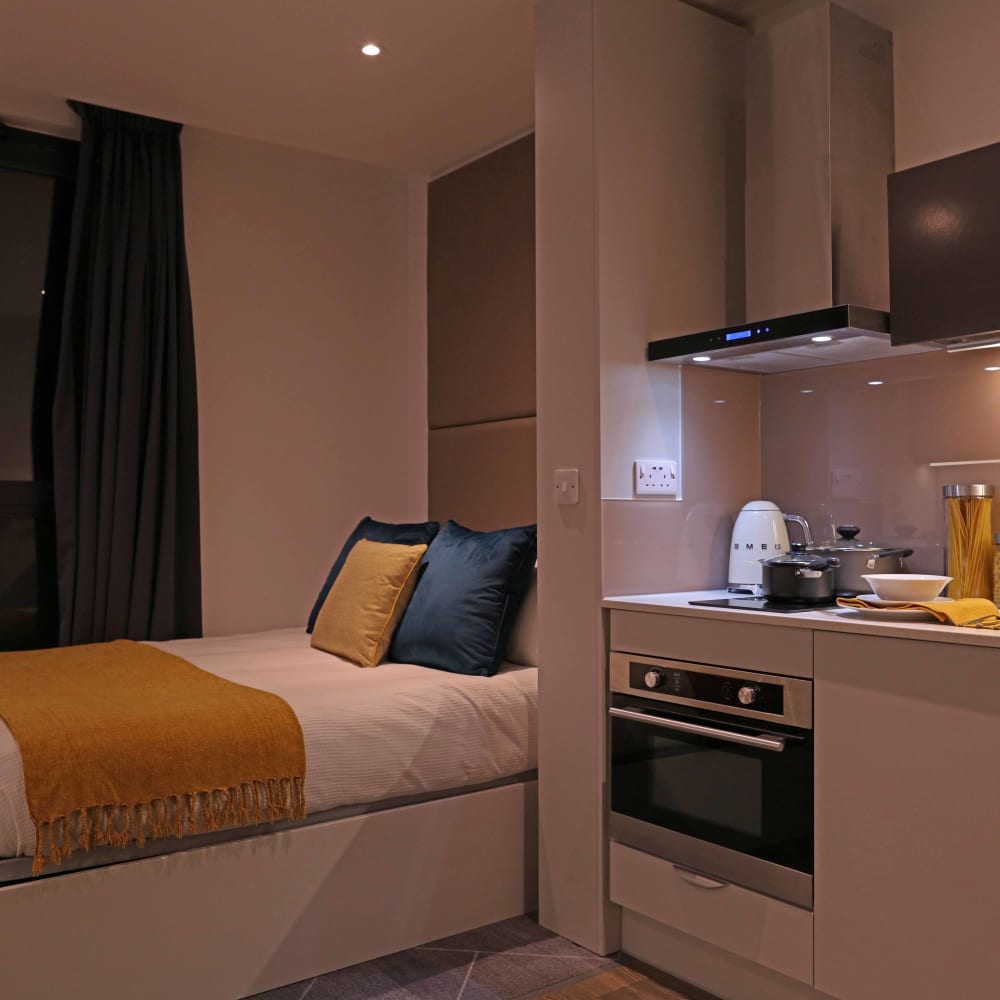 Luxury student accommodation in Birmingham with kitchen area and bed
