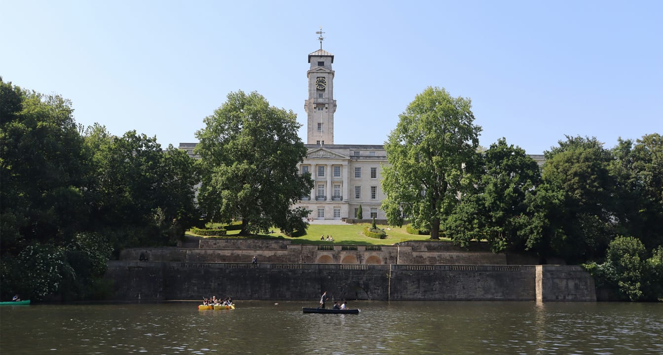 Nottingham park on a sunny day with people punting on the river.