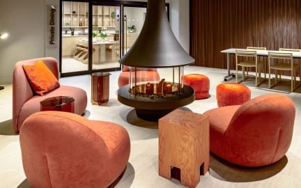 Chairs surround a fireplace in a student accommodation room