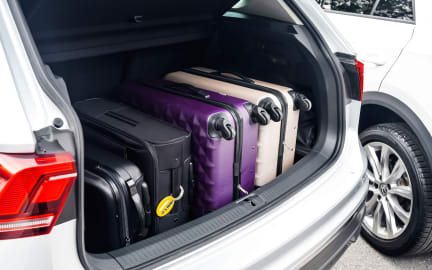 Four suitcases in a car boot