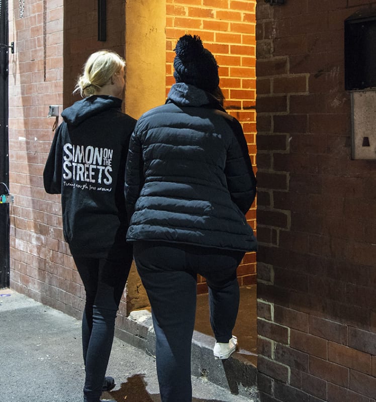 An outreach worker accompanying a client to enter a service