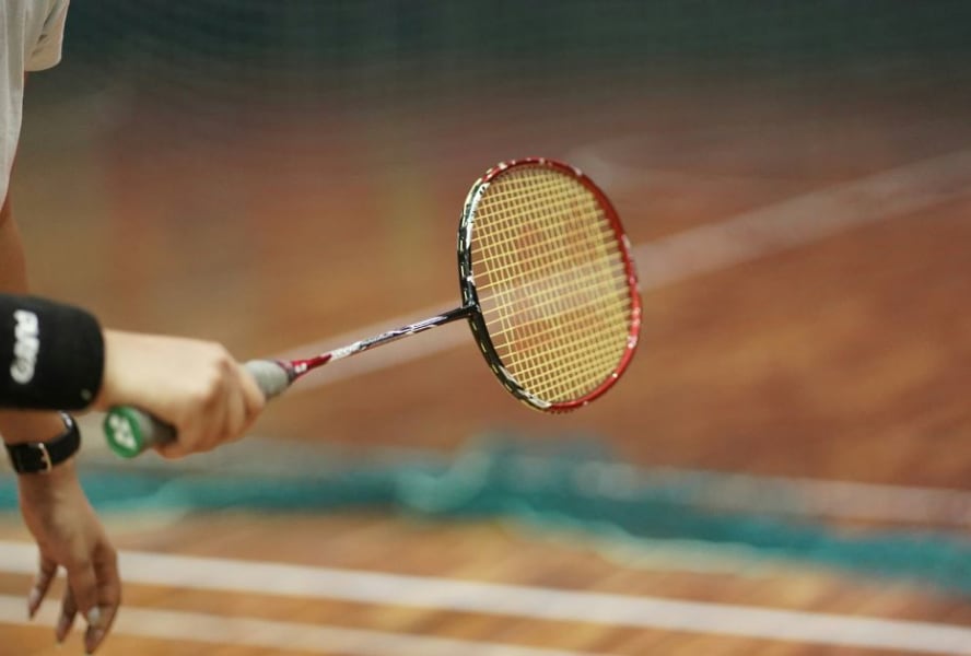 Man holding badminton racket
