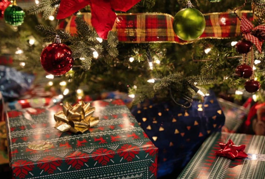 Christmas gifts wrapped under the tree.