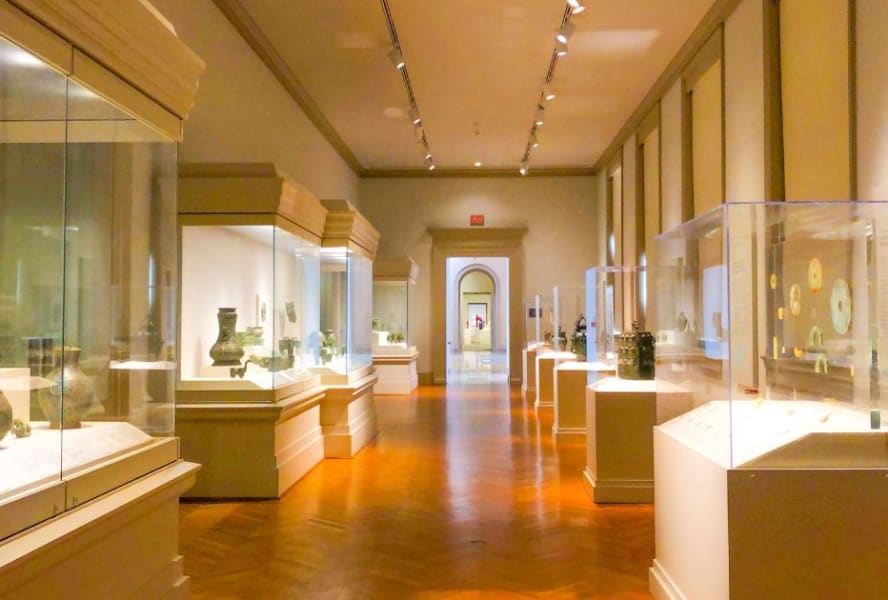 Museum with glass showcases and wood flooring