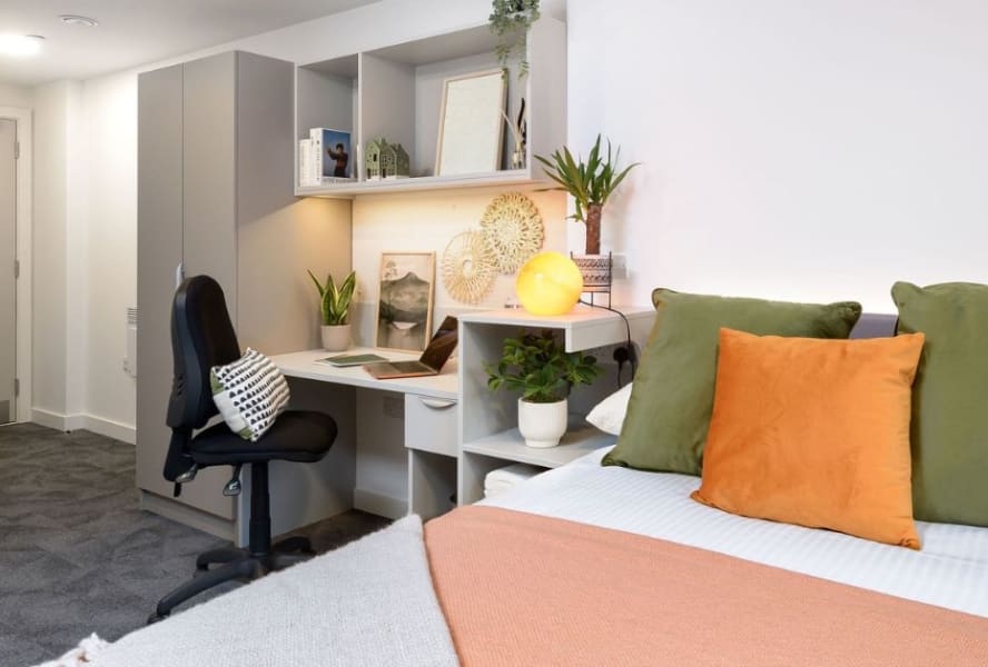 Student bedroom with a bed and desk