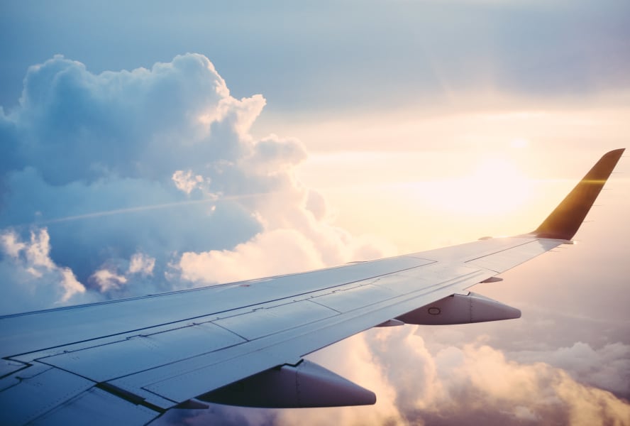 Close up of aeroplane wing through clouds