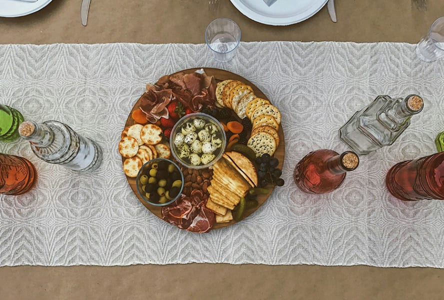 Charcuterie board with crackers, cheese, meat and carrots