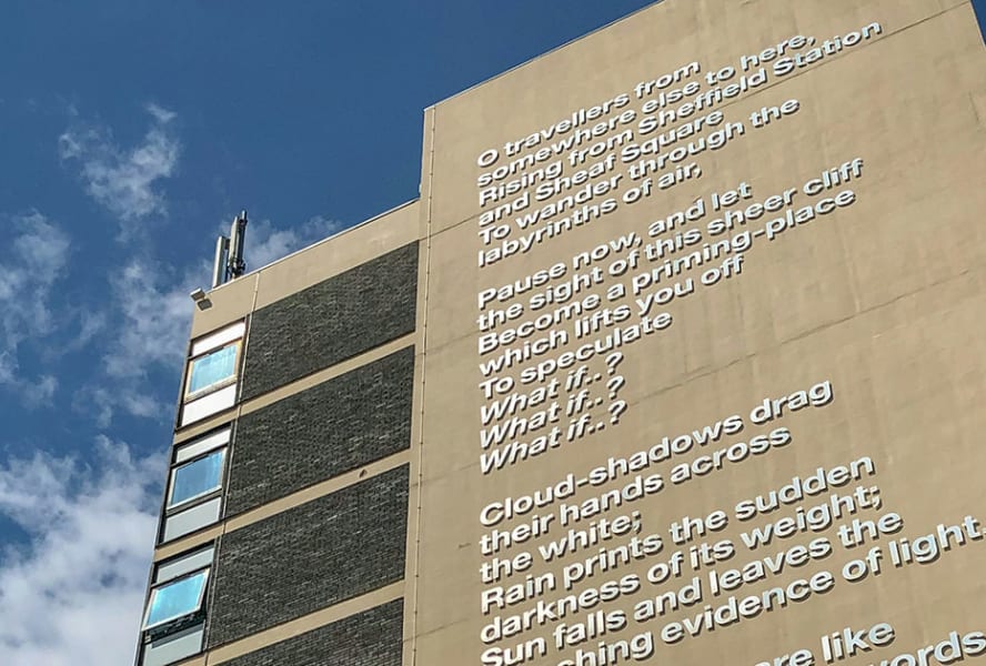 Text on the side of Sheffield Hallam University, reciting a poem.