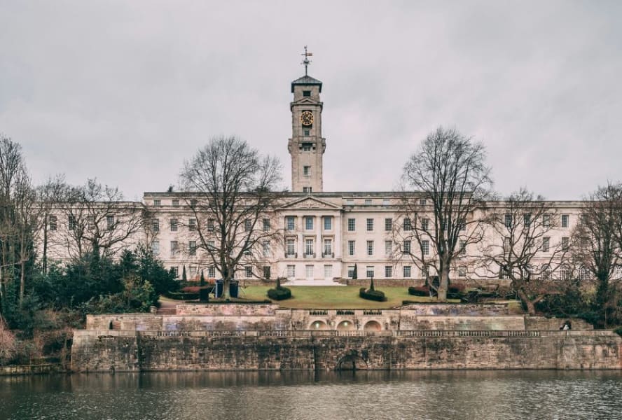 University of Nottingham building by riverside with clock tower