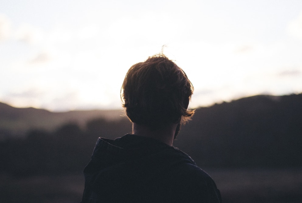 A man faces away from the camera