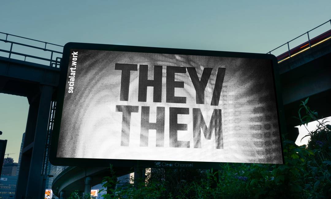 They/Them pronouns displayed on a billboard at dusk by an overpass