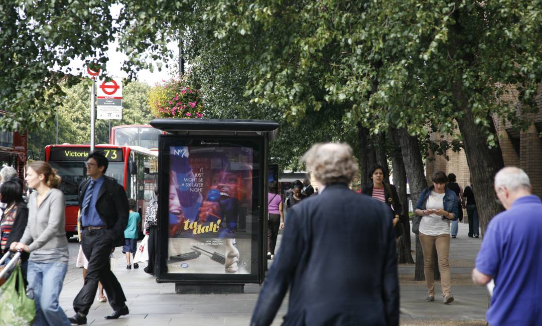 Adshel screen on a busy road show a No7 advert for Boots