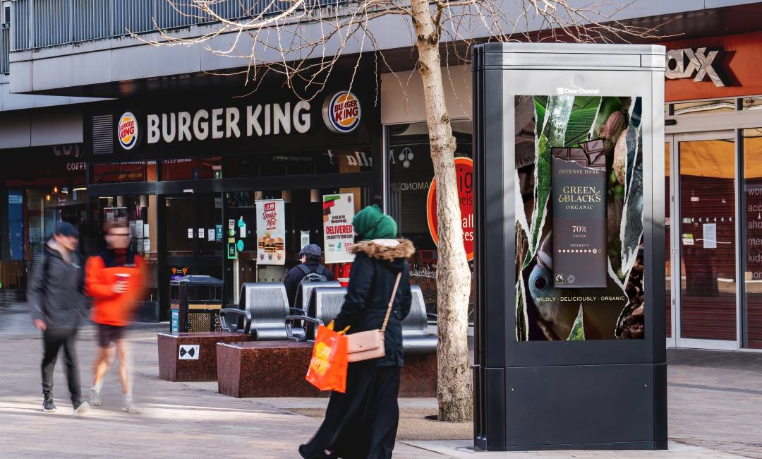 Digital screen outside Burger King showing Advert for Green & Black's