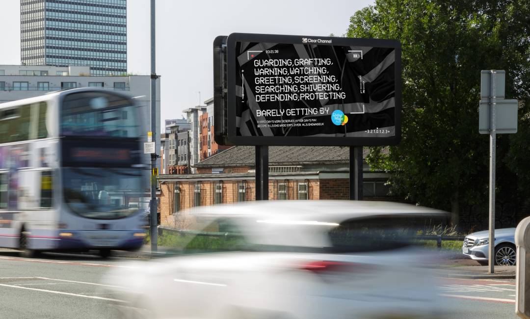 Billboard Live screen showing Living wage campaign