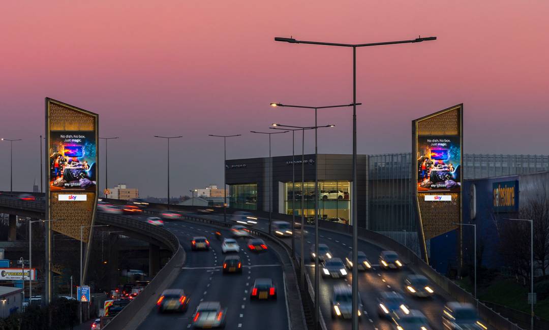 Digital advert on north London Towers at dusk