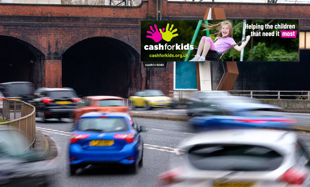 Cash For Kids charity poster on a BMO digital billboard