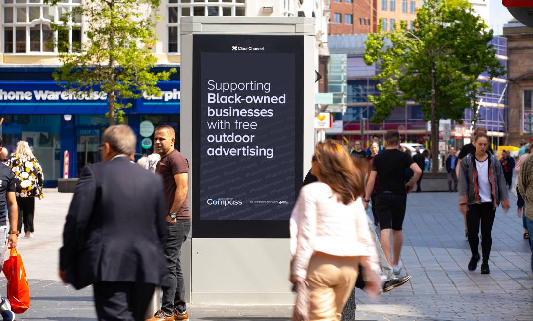 Adshel screen displays black image and text 'Supporting Black-owned businesses with free outdoor advertising.'