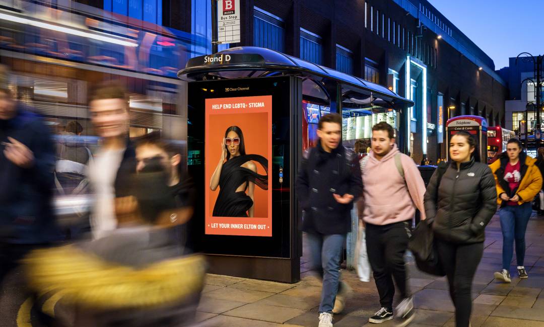 Let Your Inner Elton Out ad showing on a bus shelter on a busy street