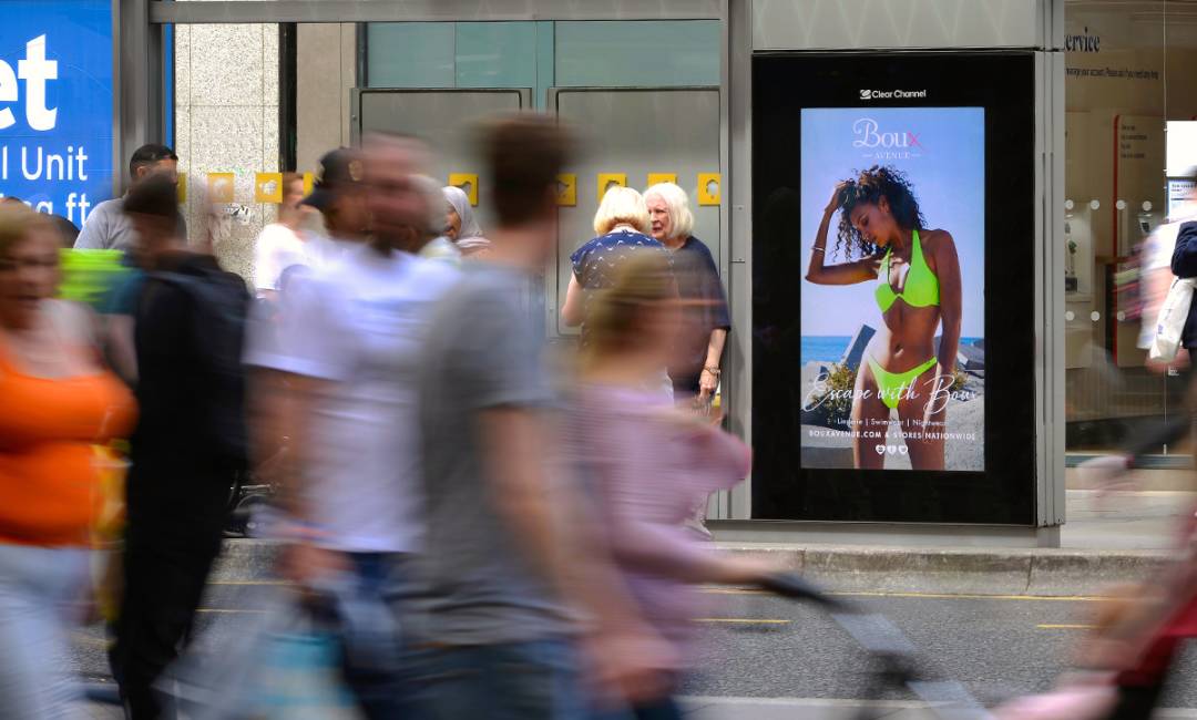 Adshel Live screen showing Boux Avenue Advert of Girl in a Bikini