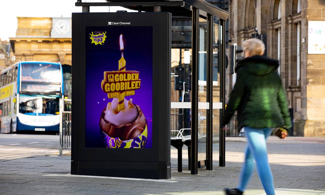 Cadburys advert on Ashel Live poster on bus stop