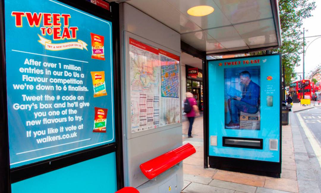 A bus shelter that has been transformed into a vending machine as part of an advertising campaign for Walkers crisps