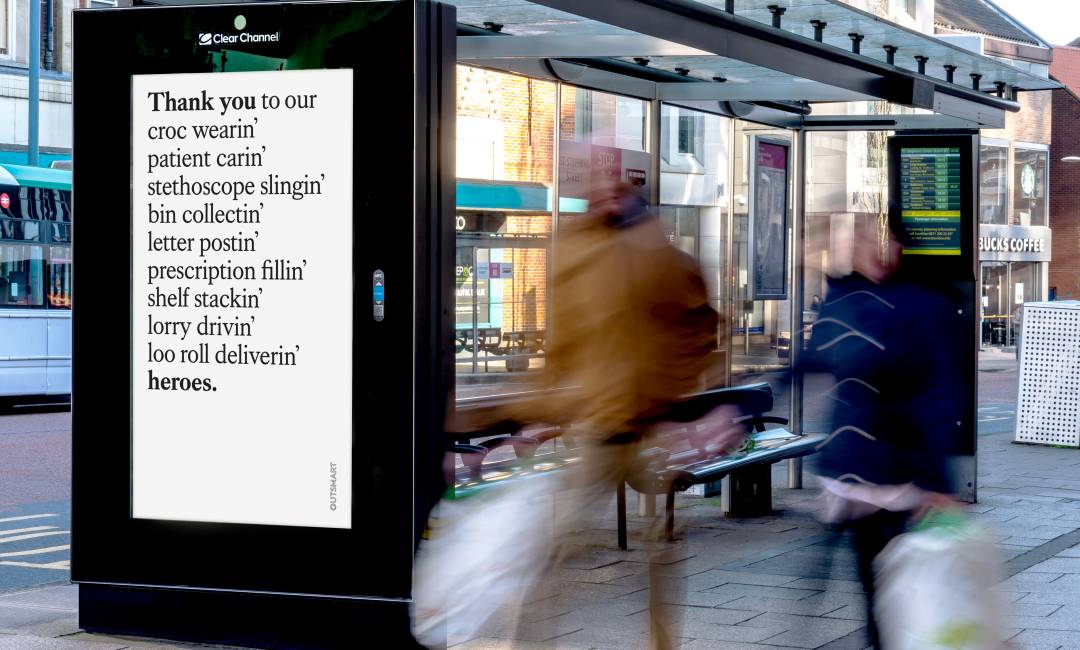 Adshel live screen on bus stop showing Outsmart advert