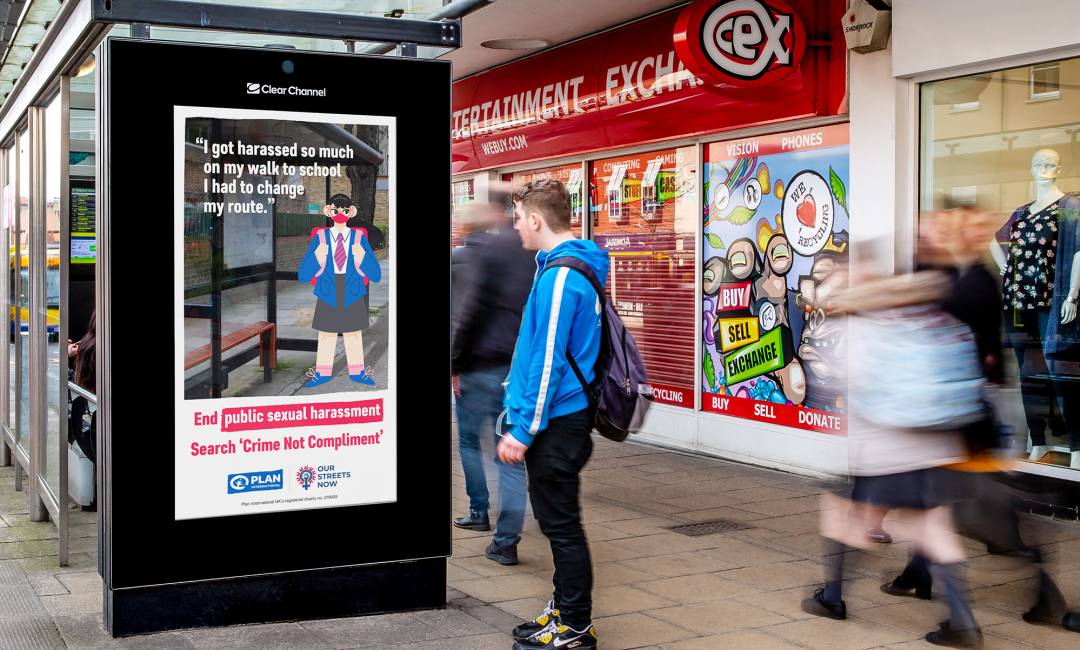 billboard on a bus stop showing ad for Plan International UK